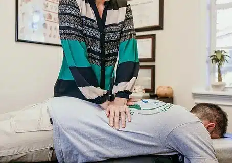 a man doing a chiropractic service