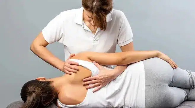 a chiropractor doing a back pain massage