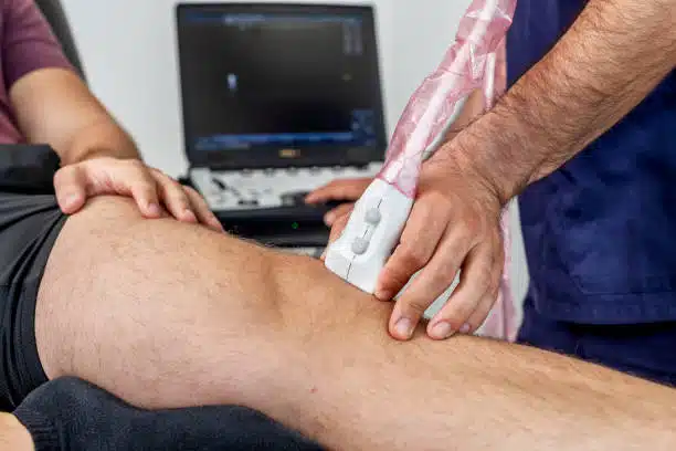 Electric Muscle Stimulation treatment for runner's knee.