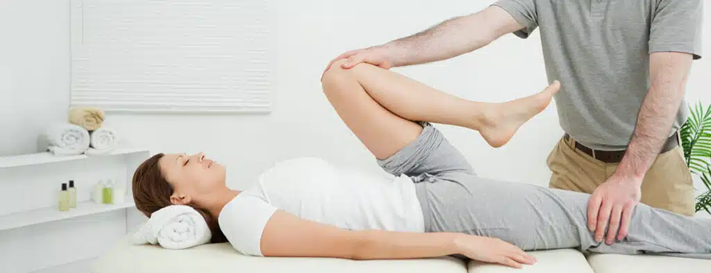 Chiropractic adjustment to treat runner's knee.