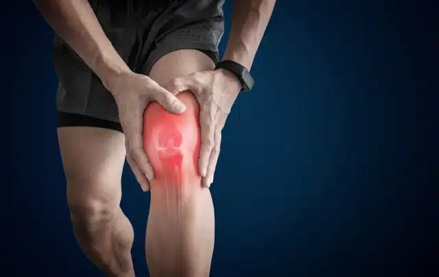 A guy experiencing runner's knee pain.