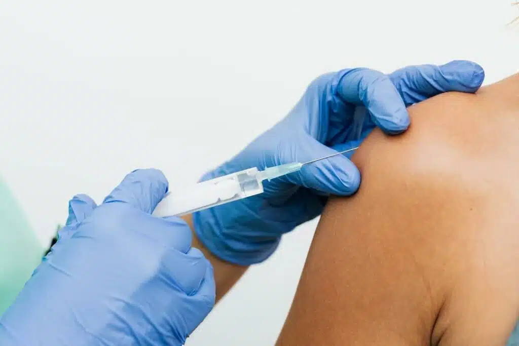 Doctor doing the trigger point injection to the patient