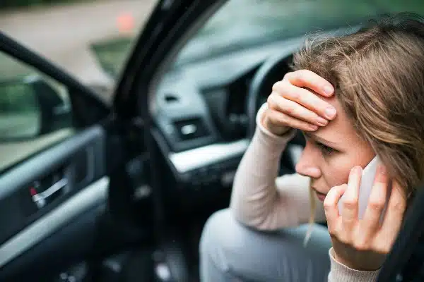 young female on the phone after a recent car accident