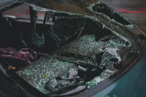 car crash with broken back glass window
