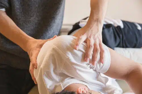 chiropractor massaging a patient of car accident