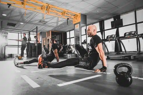 guys exercising inside a gym