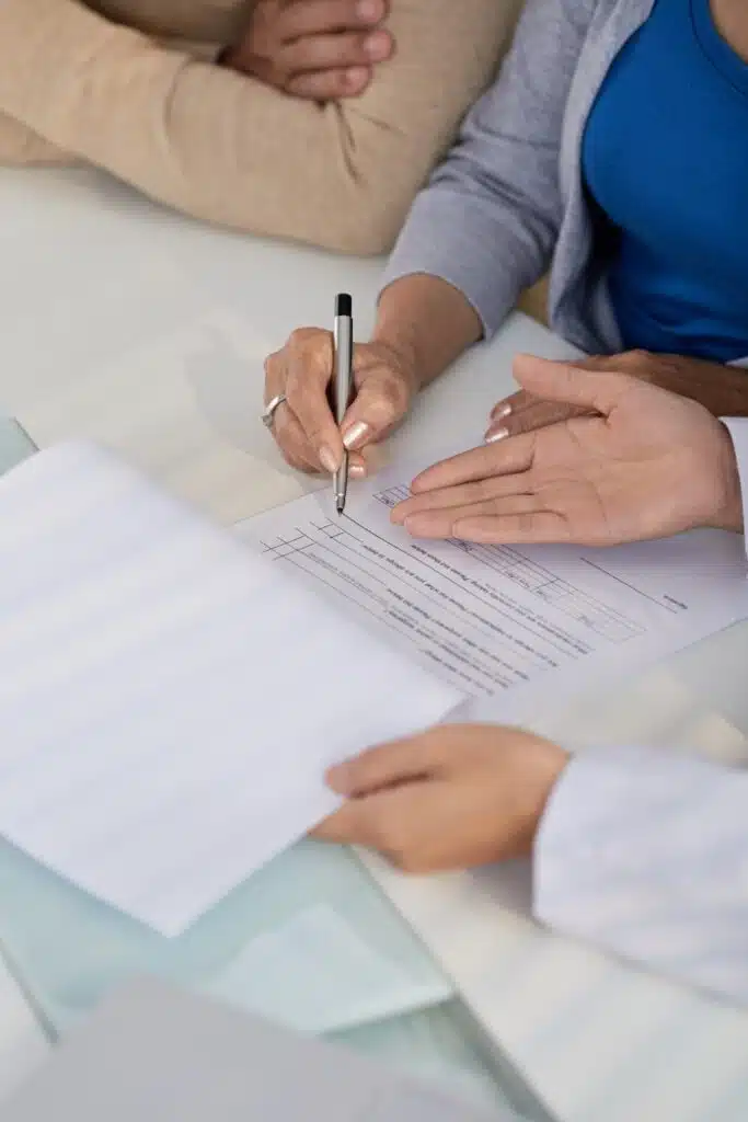 doctor showing patients medical paperwork 