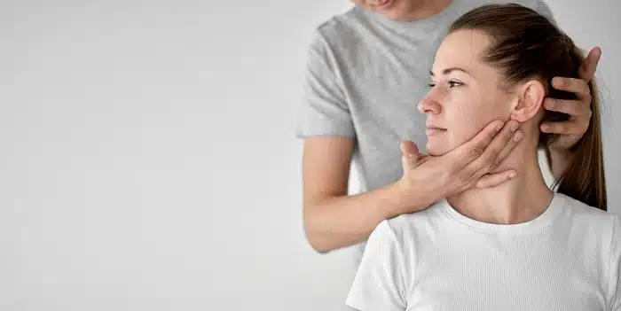 Chiropractor performing a neck adjustment on a patient