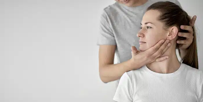 Female patient during chiropractic TMJ treatment