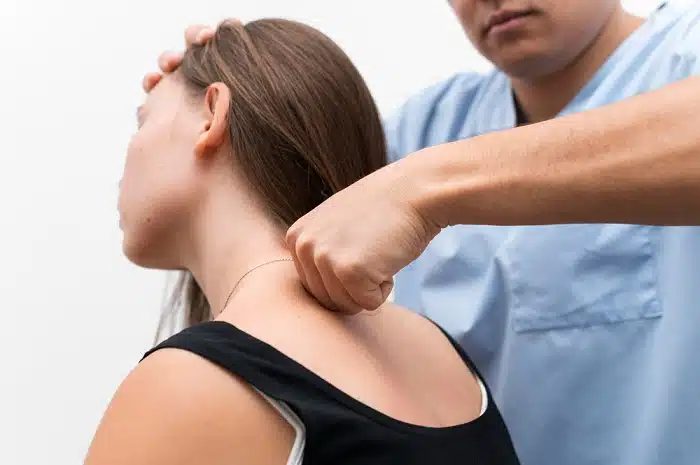 Patient receiving a safe chiropractic neck adjustment