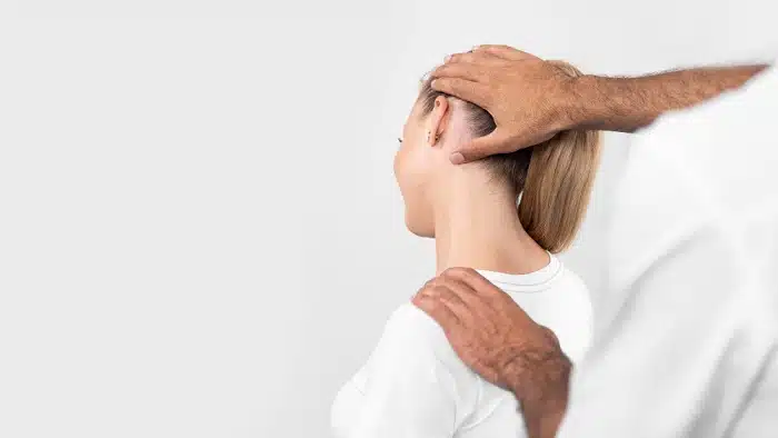 Professional chiropractor assessing a patient's neck