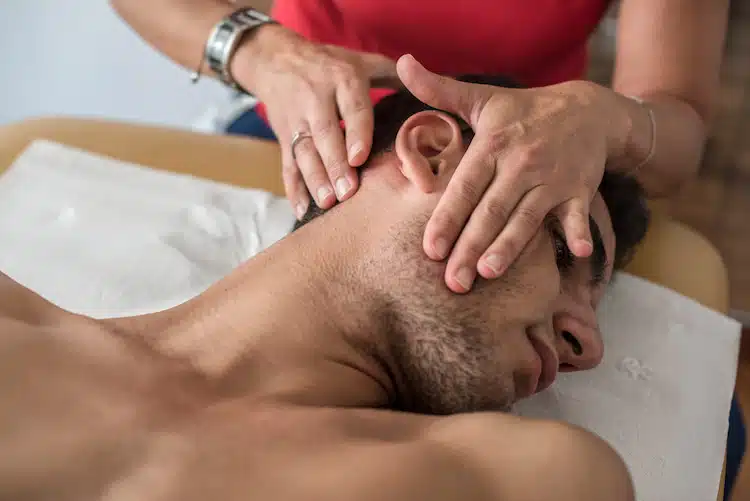 man with tmj getting treated with chiropractic care