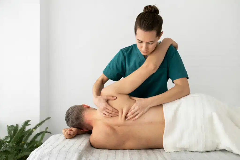 nurse taking care patient doing a therapeutic massage 