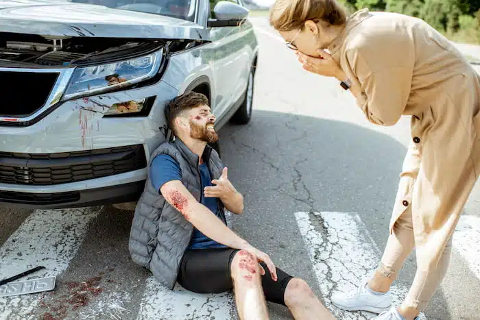 man getting injured after being hit by a car